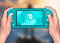 Consola Nintendo Switch Lite con fondo de juego