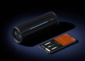 Altavoz Xiaomi Bluetooth Speaker junto a un móvil